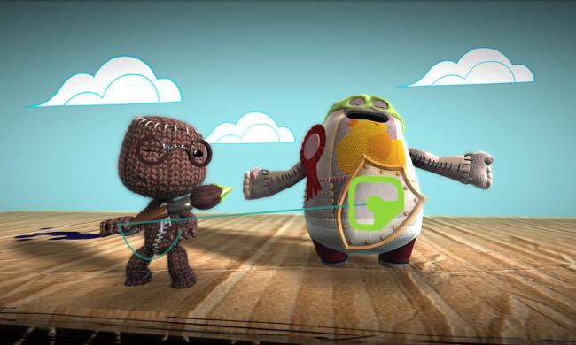 A sackboy with glasses pulling on green thread with another guy standing next to him.