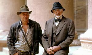 Harrison Ford sits next to Sean Connery in Indiana Jones and the Last Crusade.