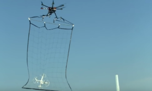 watch japans bizarre net wielding police drone in action japanese catcher