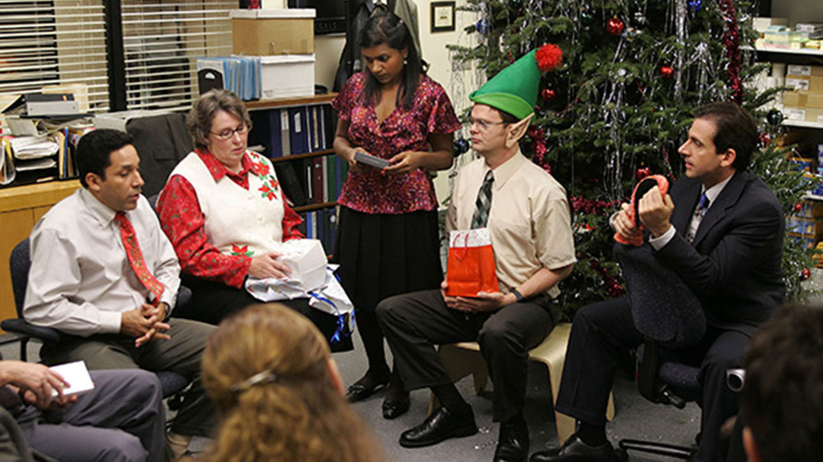 Oscar, Phyllis, Kelly, Dwight, and Michael at a Christmas Part in "The Office."