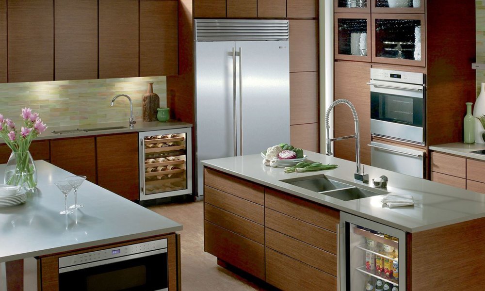 Stainless steel refrigerator in kitchen.