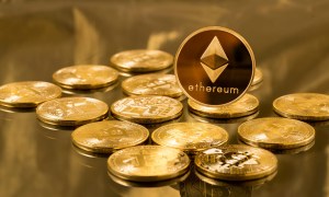 Ethereum coins sitting on a desk.