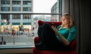 Woman using phone on 4G speeds