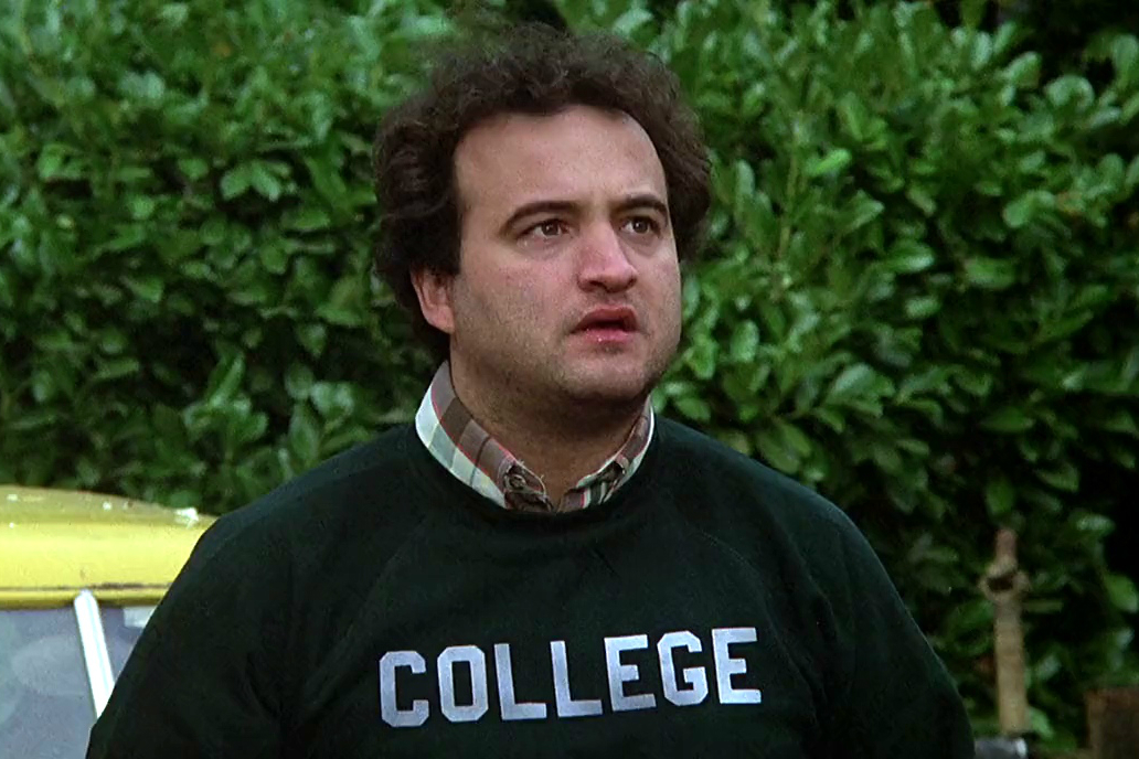A man with a college sweatshirt looks confused.