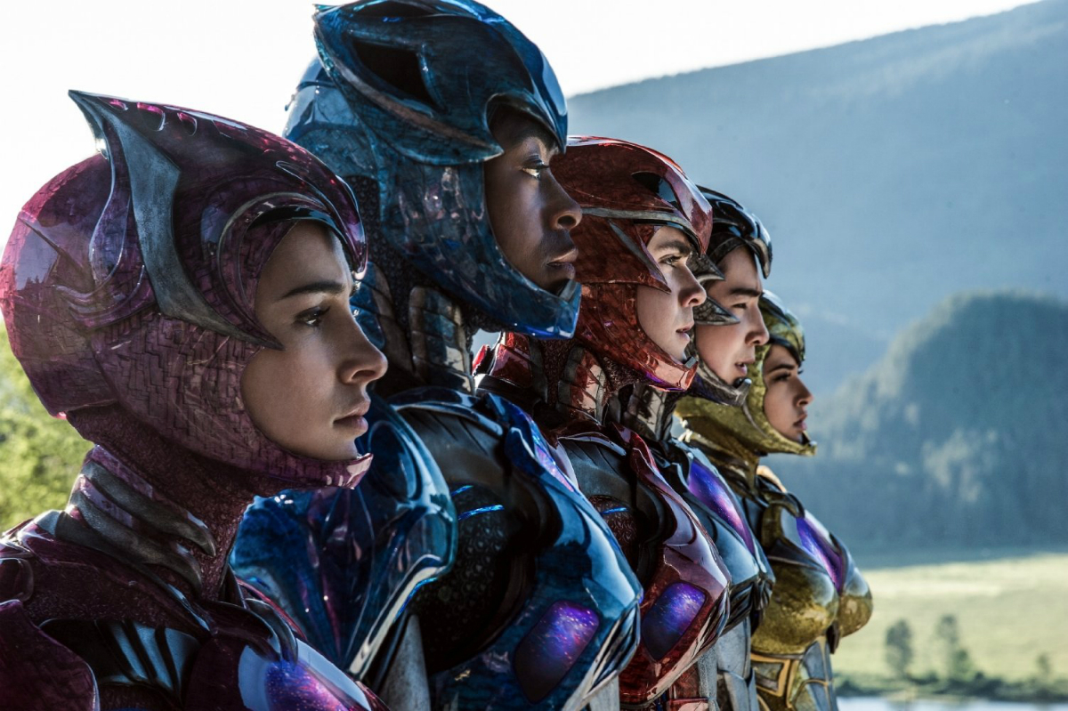 The Power Rangers stand in unison and stare.