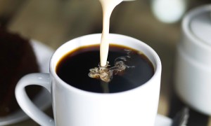 pouring cream in coffee