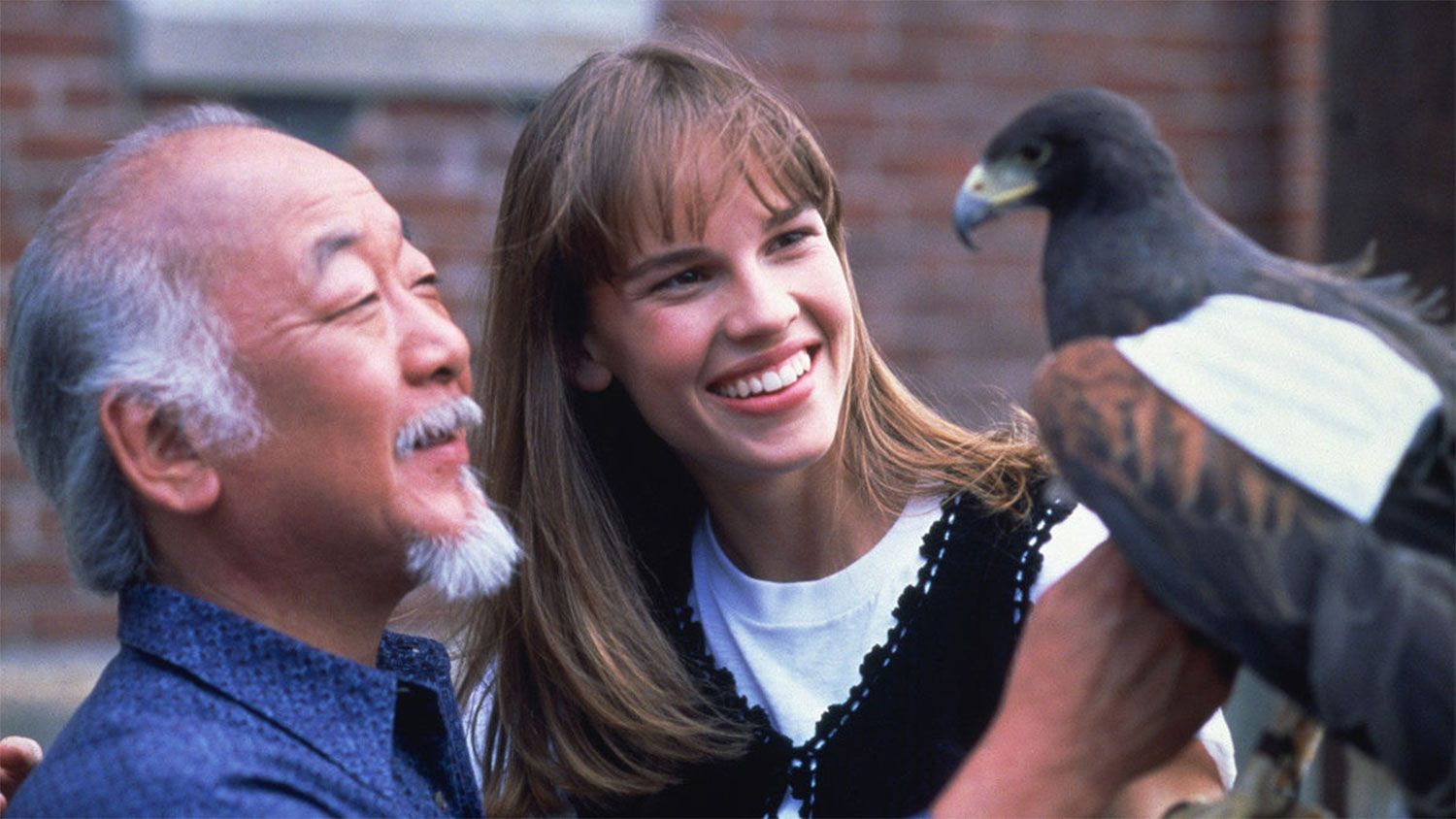 Mr. Miyagi and Julie pet an eagle in The Next Karate Kid.