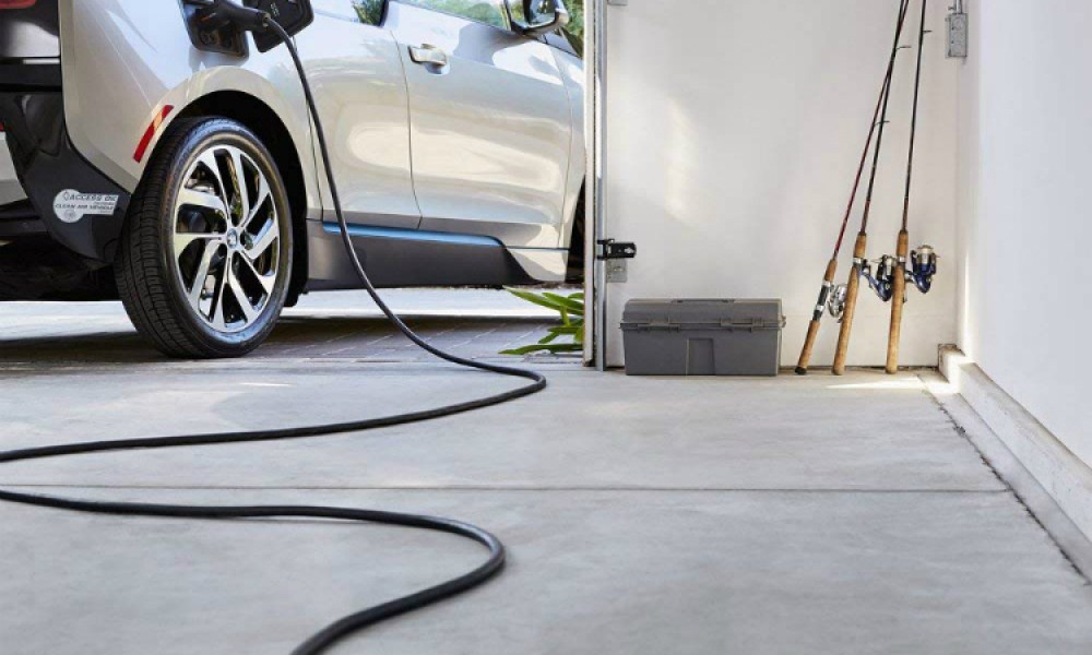 ChargePoint Home EV charger plugged into car.