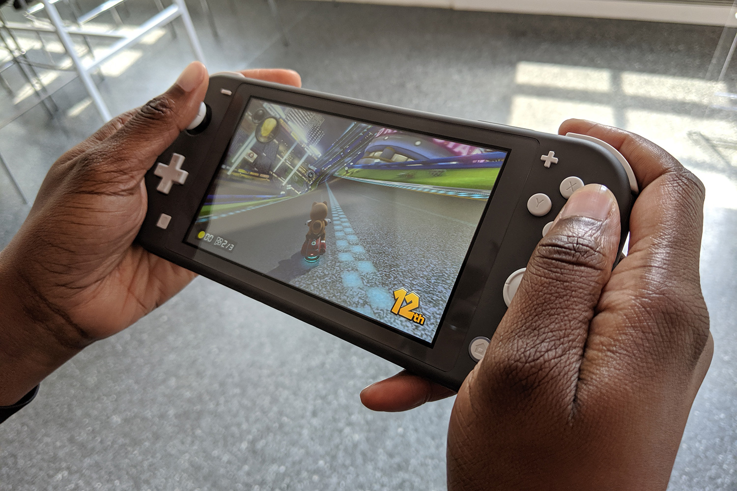 Nintendo switch lite 2024 in hand