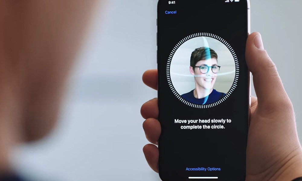 Face ID scanning a face.