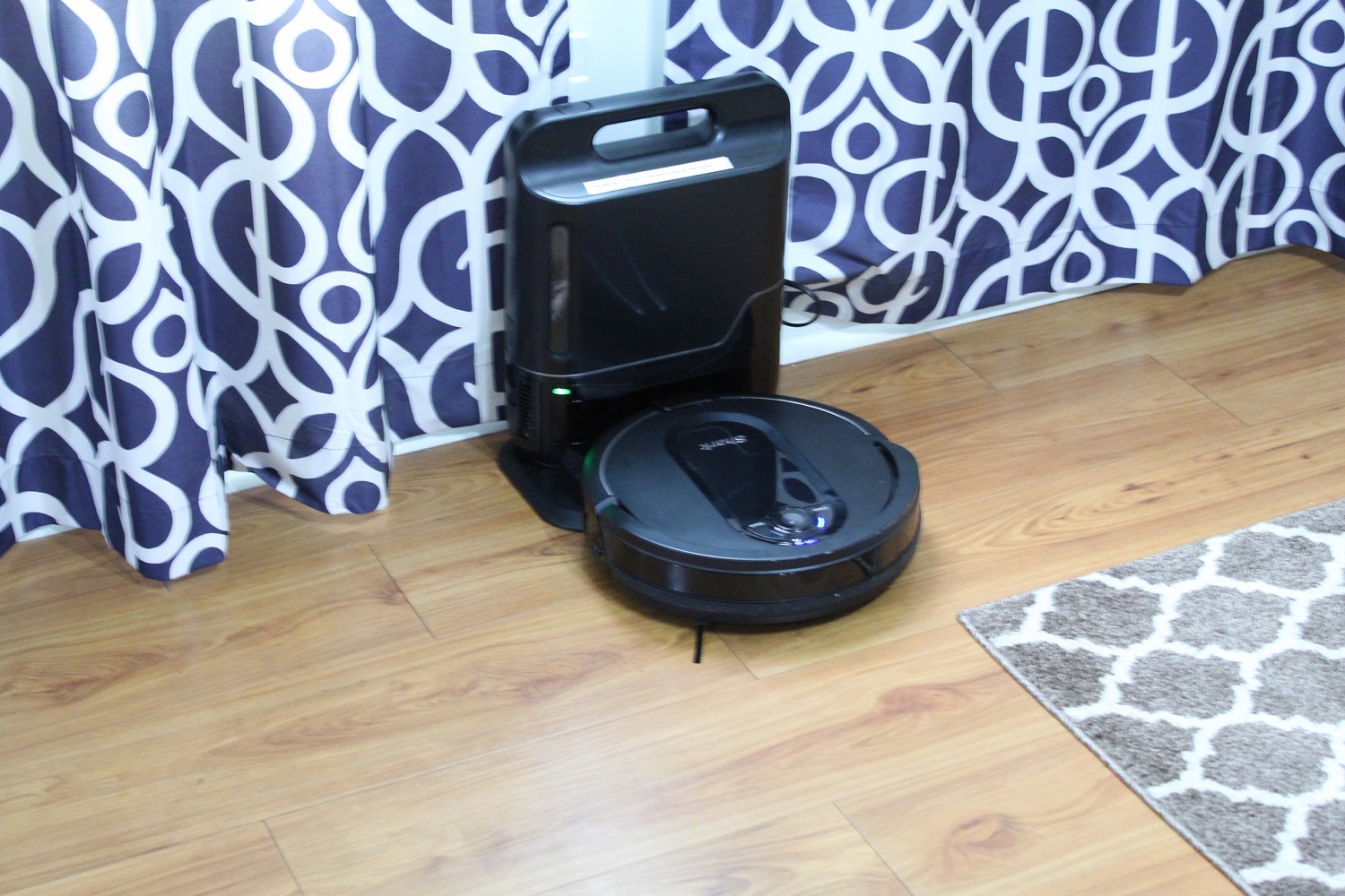 SharkIQ robot vacuum docked in its base.