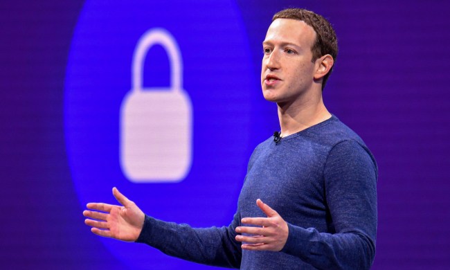 mark zuckerberg speaking in front of giant digital lock