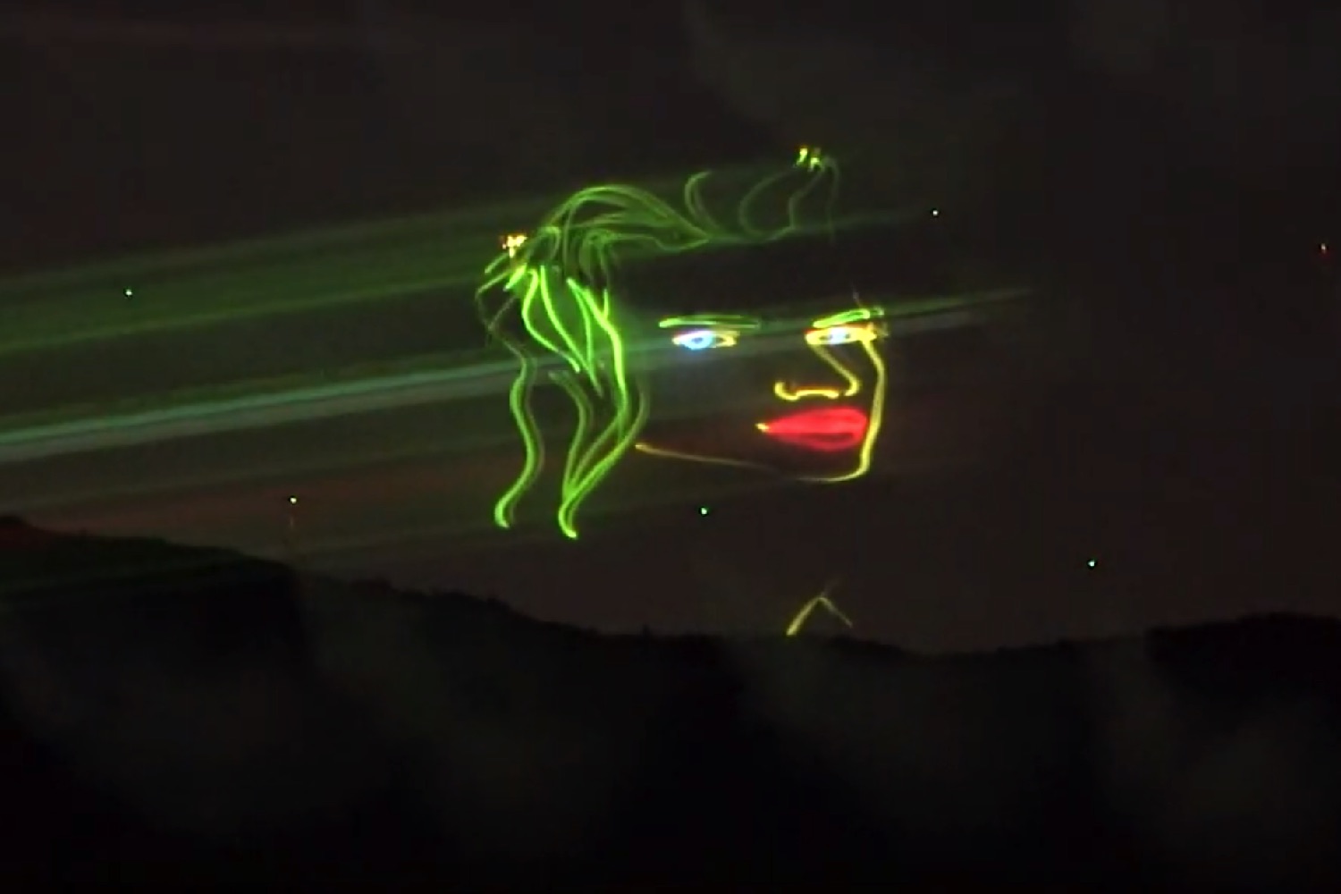 Aerial Drone Display Uses Smoke Machines, Laser Projection