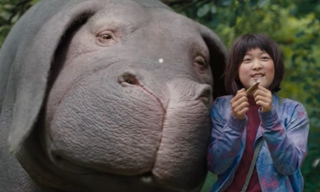 A girl and Okja in "Okja."