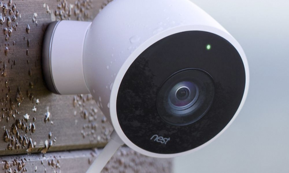 Google Nest Cam Outdoor Security Camera on the corner of a brick wall.