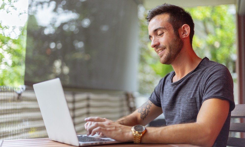 Stock photo of man using laptop