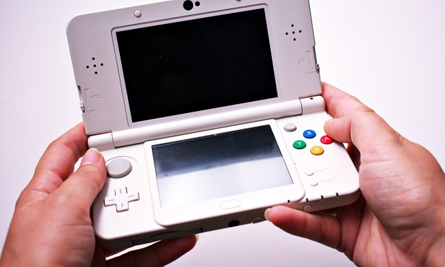 Person holding Nintendo 3DS in hands