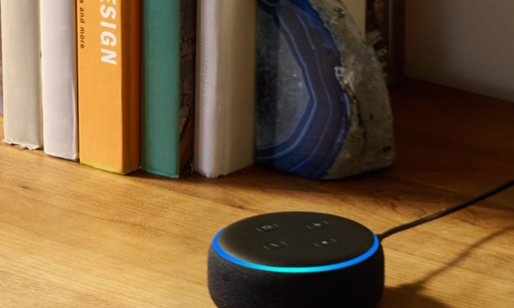 The 3rd-generation Amazon Echo Dot on a wooden surface.