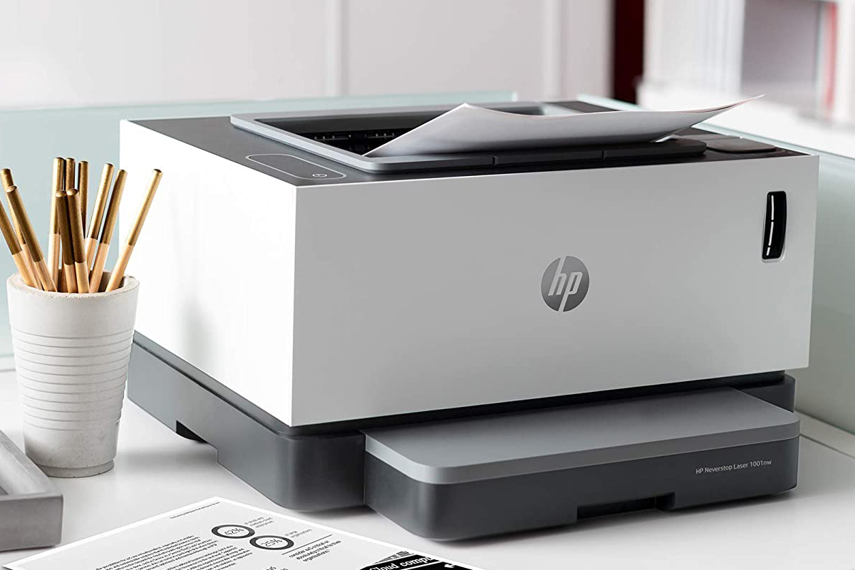 The HP Neverstop Laser 1001nw printer on a desk.
