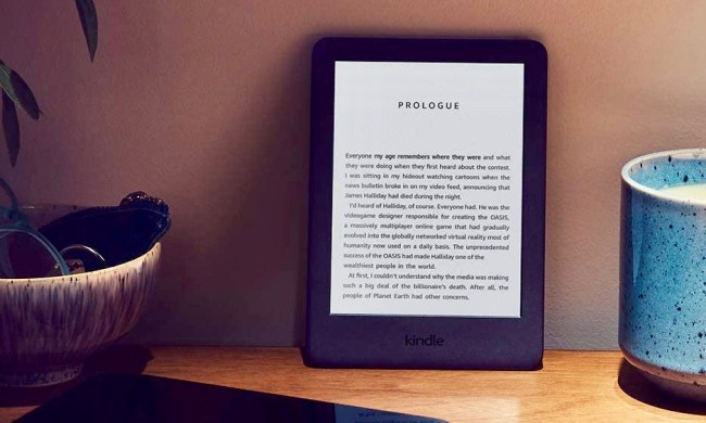 The Amazon Kindle placed against a wall while displaying a book.