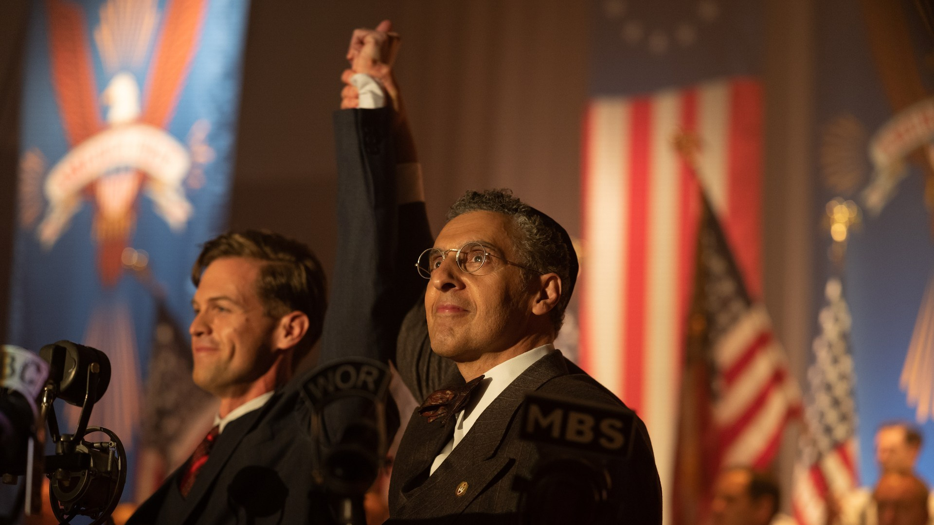 John Turturro as Charles Lindbergh on a stage in The Plot Against America
