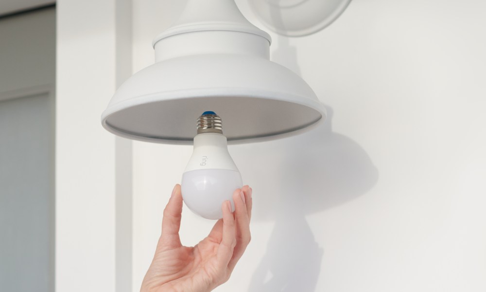 Ring Smart Bulb being installed in light fixture.