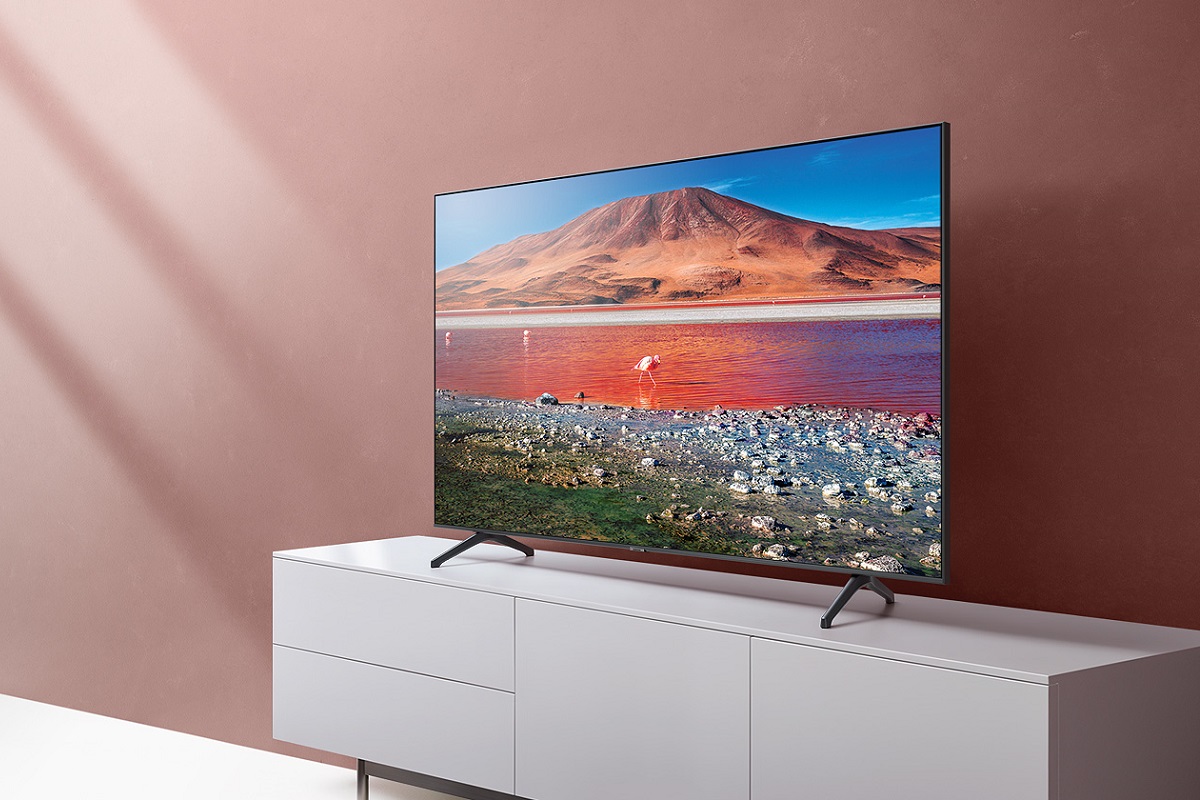 The Samsung TU7000 4K TV sits on a TV stand.