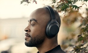 A man wearing the Sony WH-1000XM4 wireless headphones.