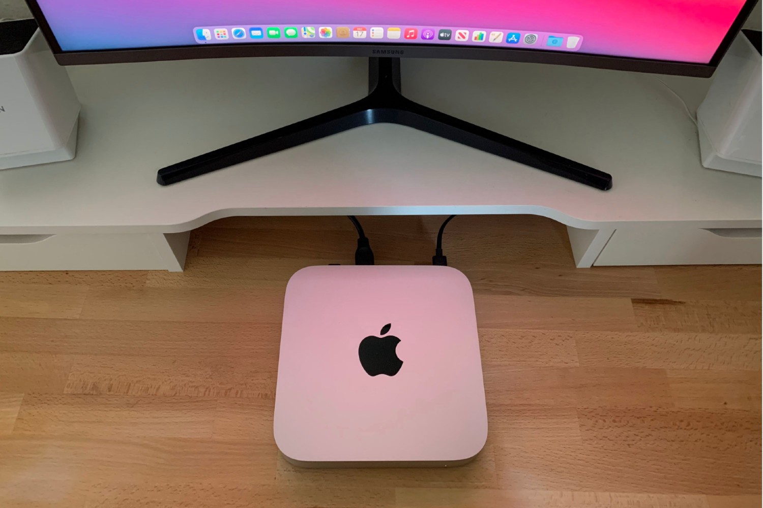 The latest Mac Mini, sitting under a PC monitor.