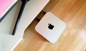 Apple Mac Mini M1 sitting on a desk.