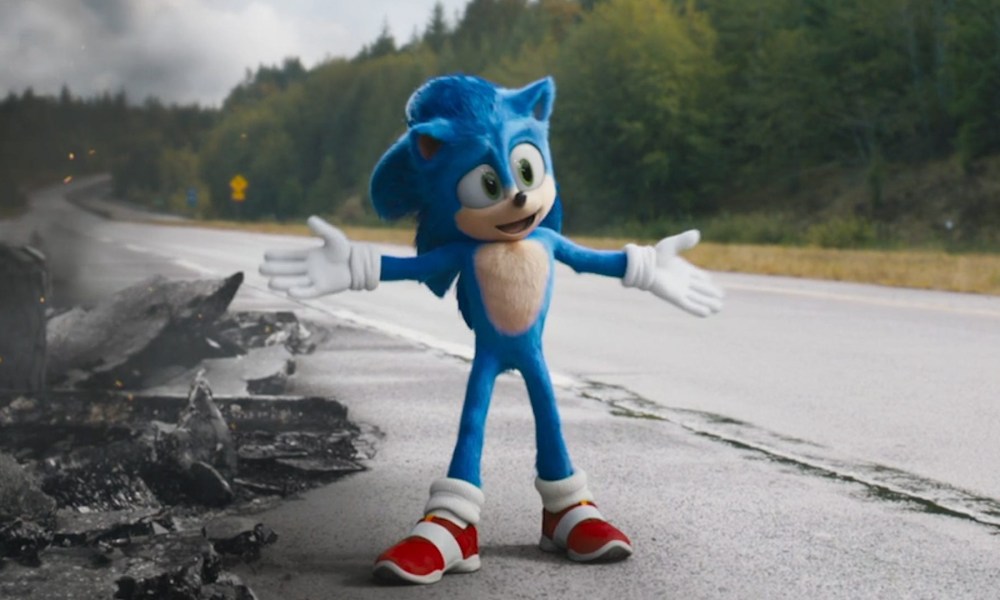 Sonic stretches his arms out on the side of a road in Sonic the Hedgehog.