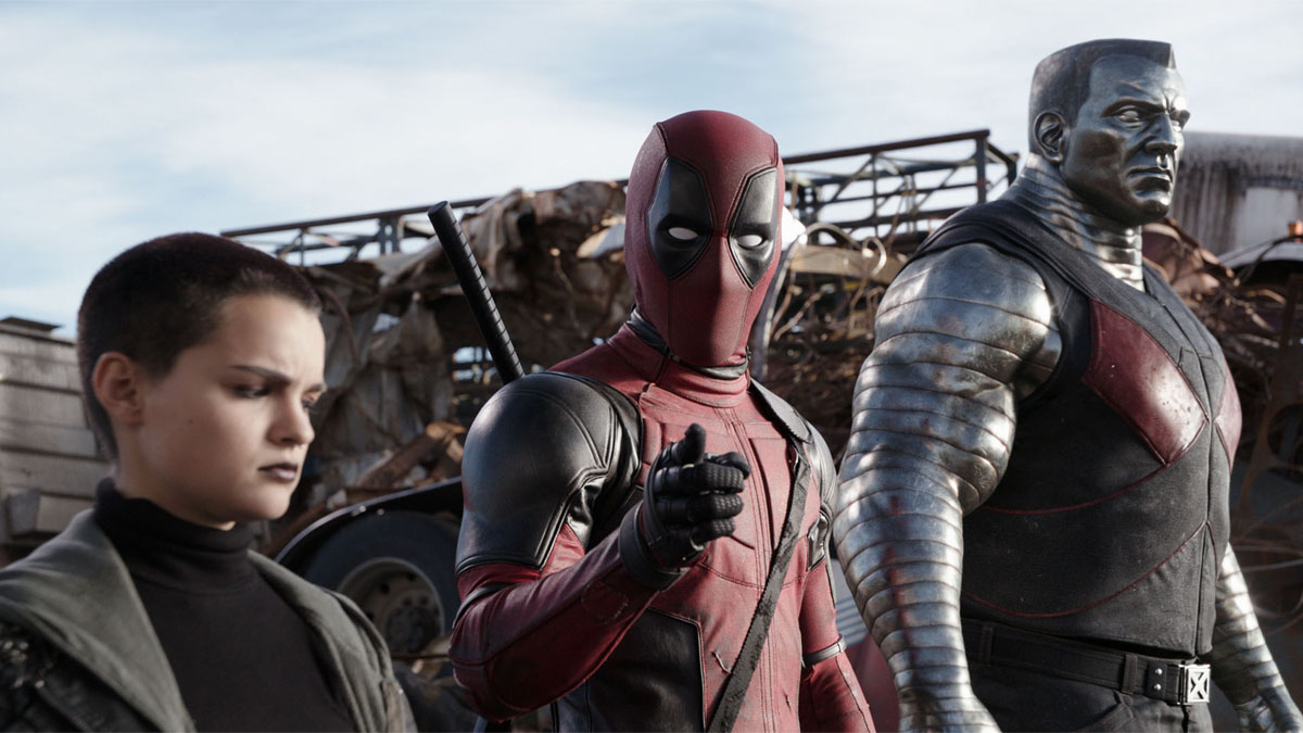 Brianna Hildebrand and Ryan Reynolds as Negasonic Teenage Warhead and Deadpool next to a CGI Colossus in Deadpool