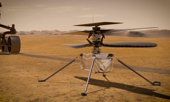 In this illustration, NASA's Ingenuity Mars Helicopter stands on the Red Planet's surface as NASA's Perseverance rover (partially visible on the left) rolls away. Ingenuity arrived at Mars on Feb. 18, 2021, attached to the belly of NASA’s Mars 2020 Perseverance rover.