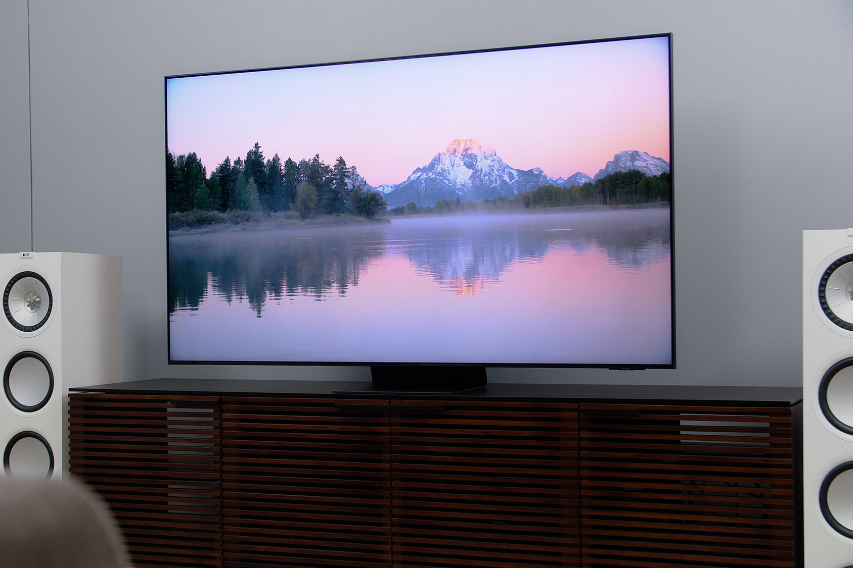 The Samsung QN90A TV in a living room.
