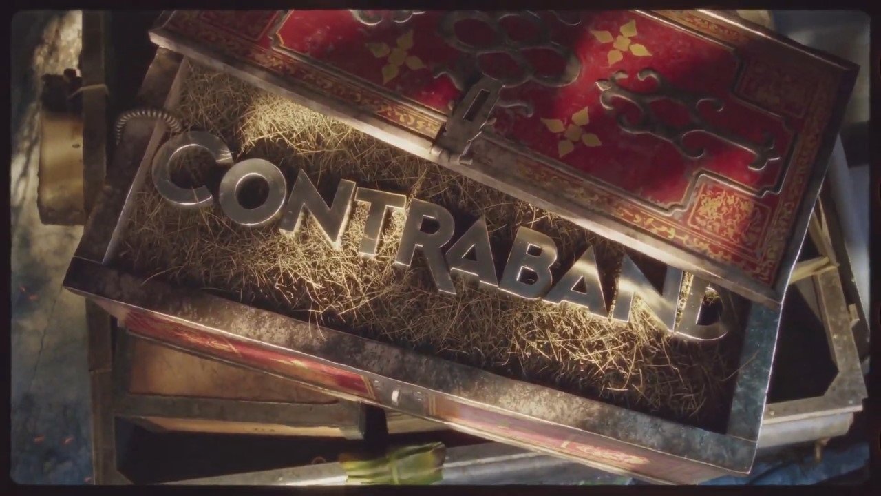 The logo for Contraband. It has "Contraband" in physical letters inside a case lined with straw.