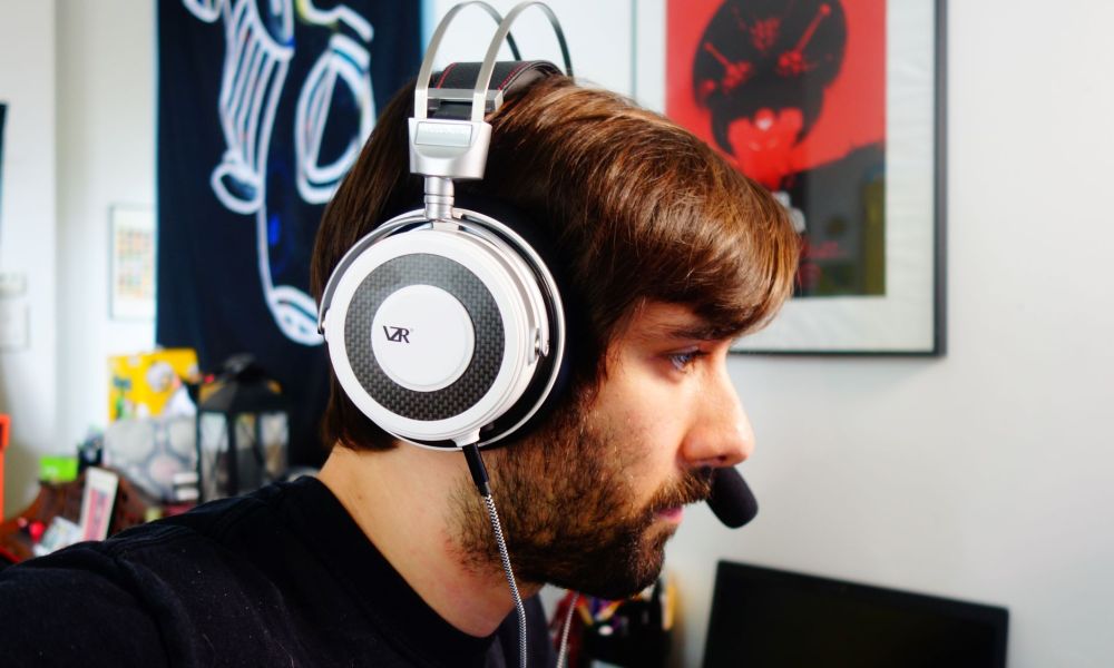 A man wearing the VZR Model One headphones.