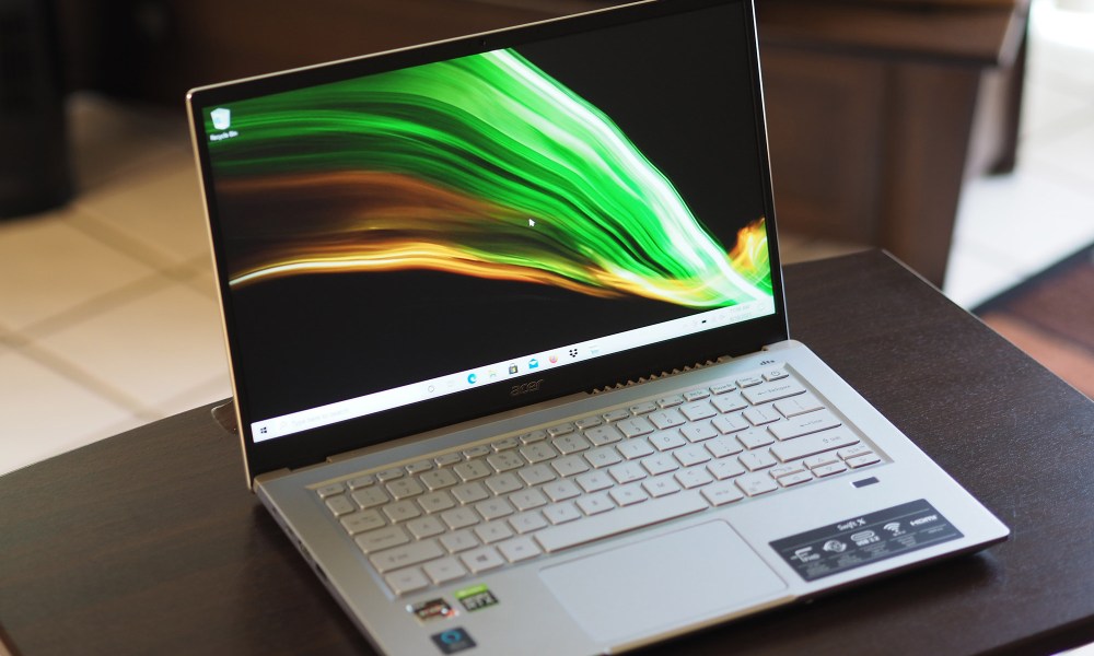 The Acer Swift X sitting on a desk.