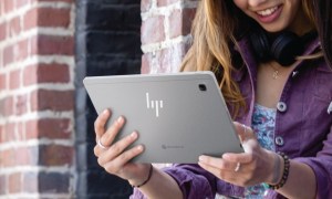 HP Chromebook held by woman.