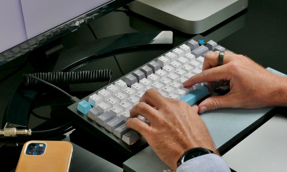 Typing on the Keychron Q1 mechanical keyboard.