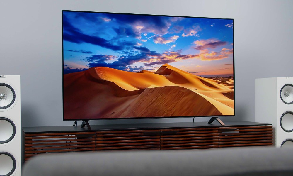 LG A1 OLED 4K HDR TV screen displaying imagery of a colorful desert.