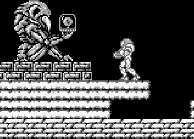 Samus next to statue in Metroid II: Return of Samus.