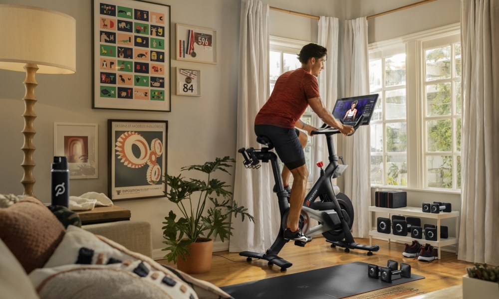 A man riding a Peloton bike.