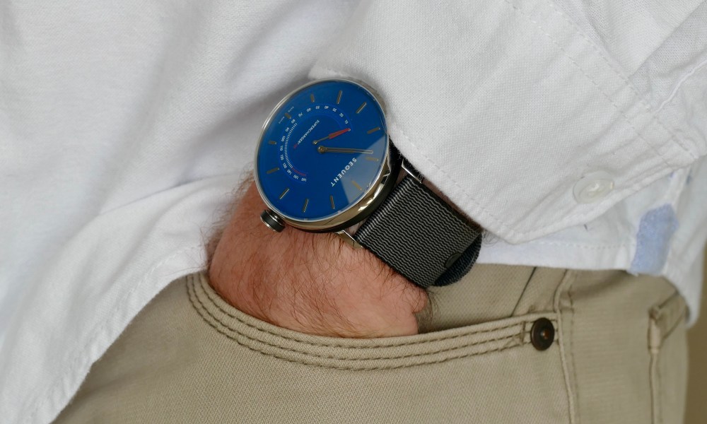 Sequent SuperCharger watch on a wrist with hand in pocket.