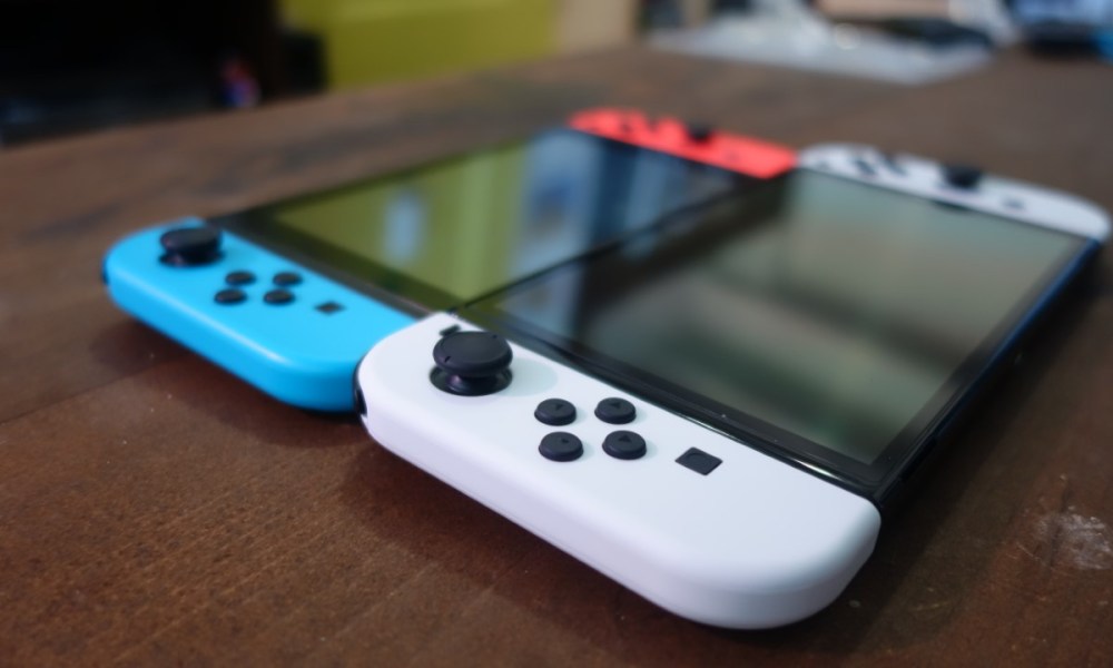 A Nintendo Switch OLED and a 2019 Switch model side by side.