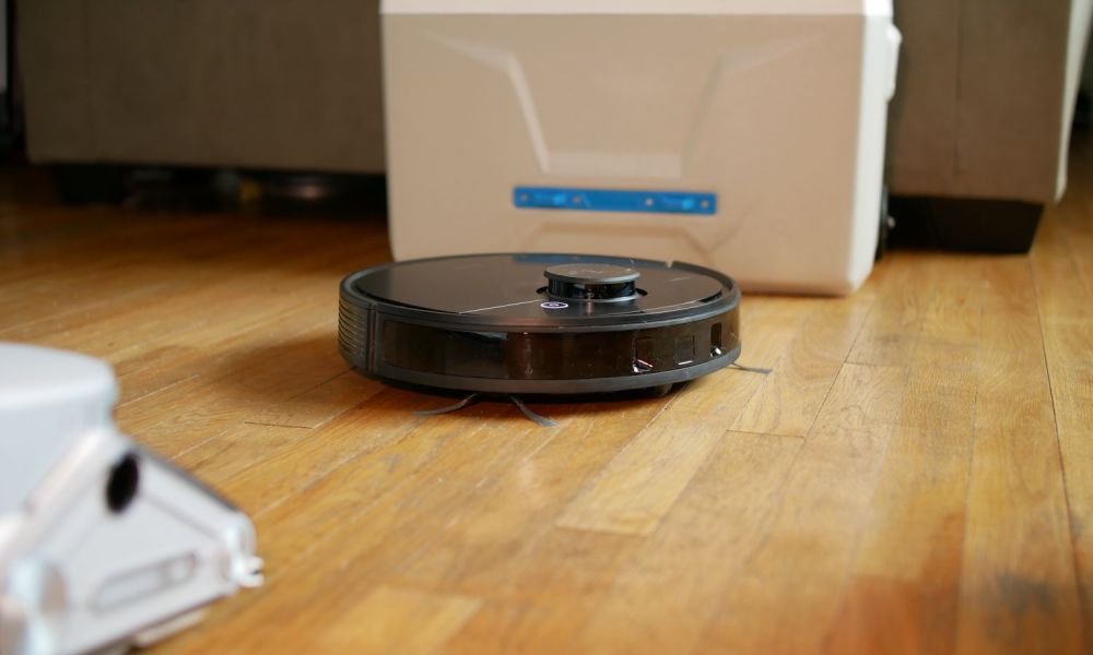 Ecovacs Deebot Ozmo N8 Pro+ on hardwood floor.