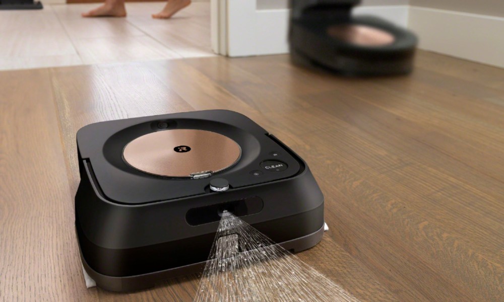 irobot roomba spraying water on wood floor with vacuum Roomba in dock behind it.