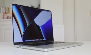 The MacBook Pro with the default wallpaper, which hides the notch.