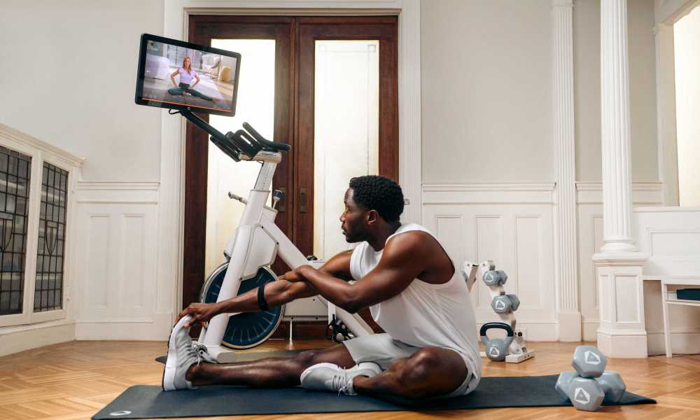 Stretching during an Openfit bike workout.