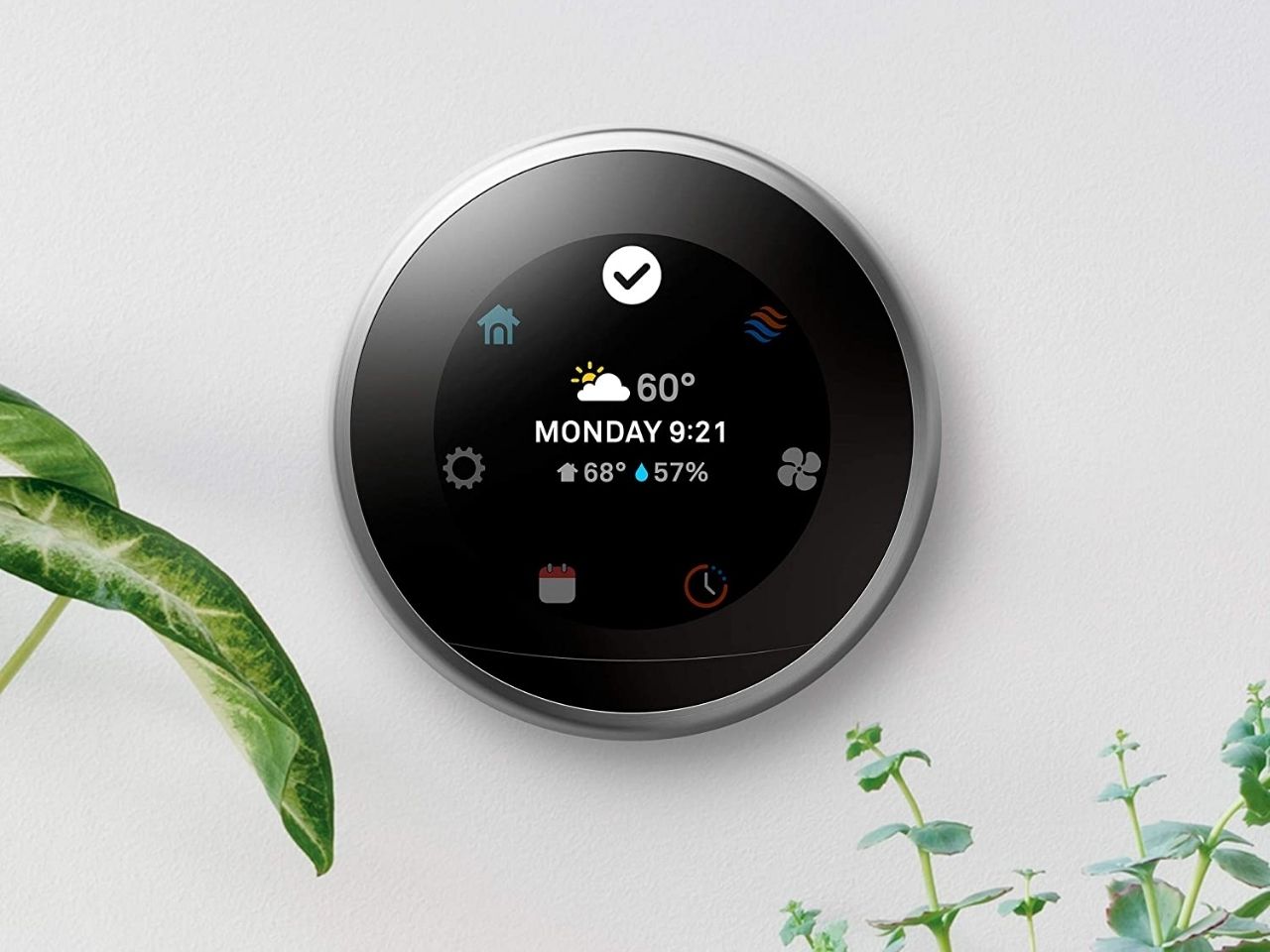 Nest Smart Thermostat on wall.