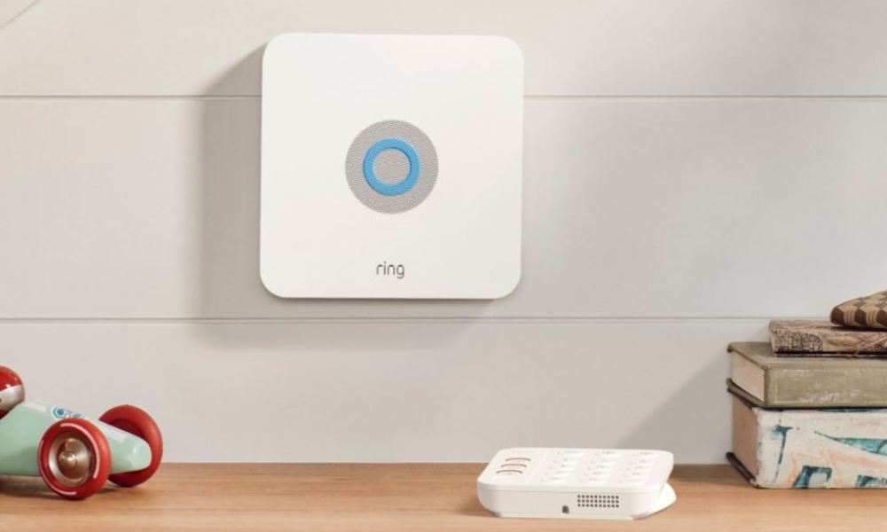 The square Ring Alarm device, mounted on a wall.